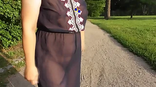 Hairy mature in transparent dress flashing in the car park